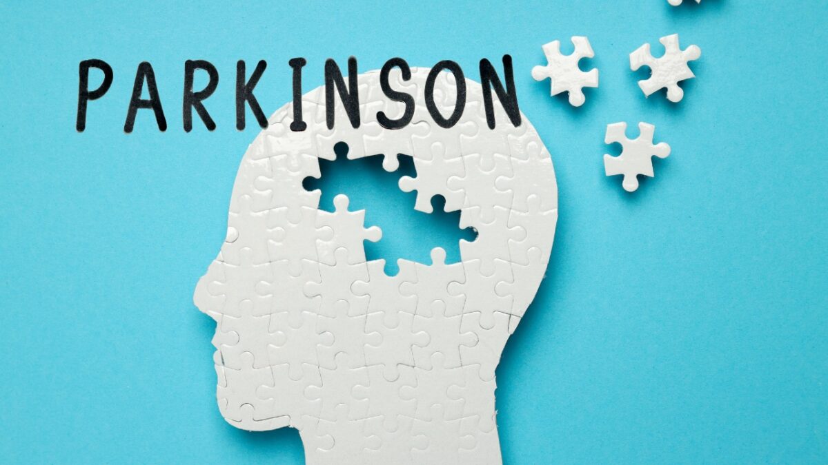 PARKINSON word with a human-like puzzle background symbolizing parkinson’s disease.