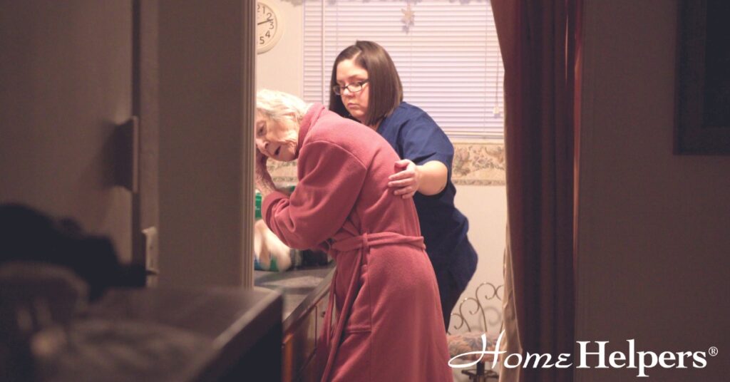 Home Health Aide helps senior with bath