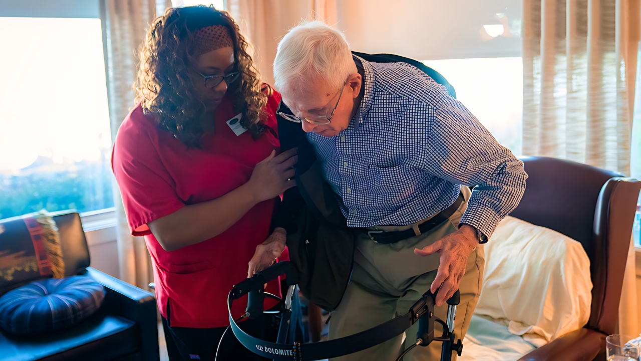 Home health aide assisting elderly veteran