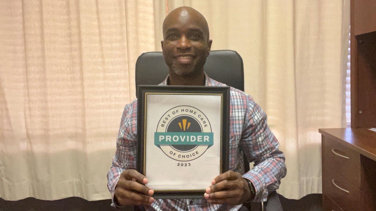 Jonathan Marsh, owner of Home Helpers Bradenton, holding the certificate of the 2023 Best of Home Care® Provider of Choice Award