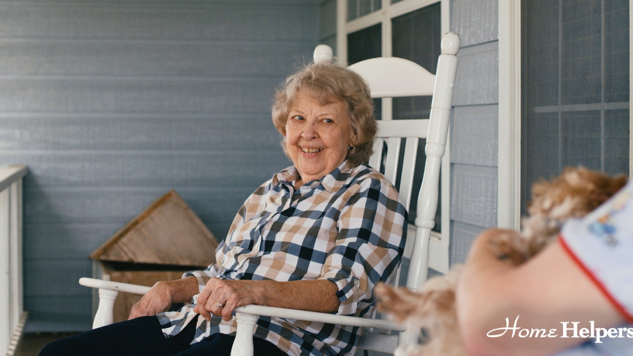 Senior with caregiver happy at home