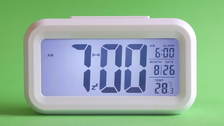 A digital clock that shows the time, date, alarm, temperature, and show AM.