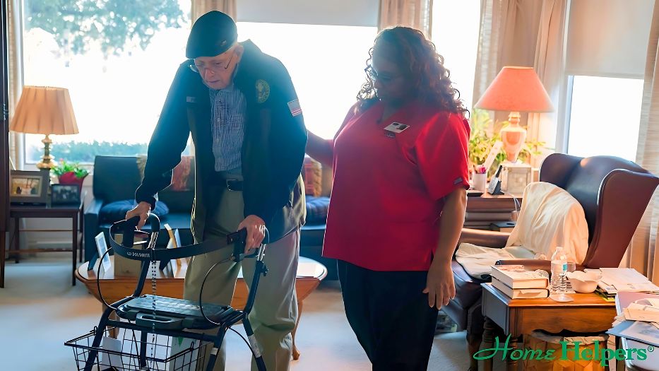 Senior using a walker with a basket with a Home Helpers caregiver by his side.