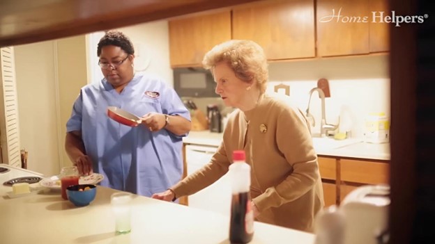 A caregiver preparing food for senior at the kicthen showing How In-Home Care Helps Seniors Live Independently