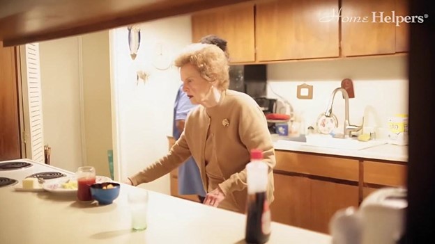 A senior person in the kitchen.
