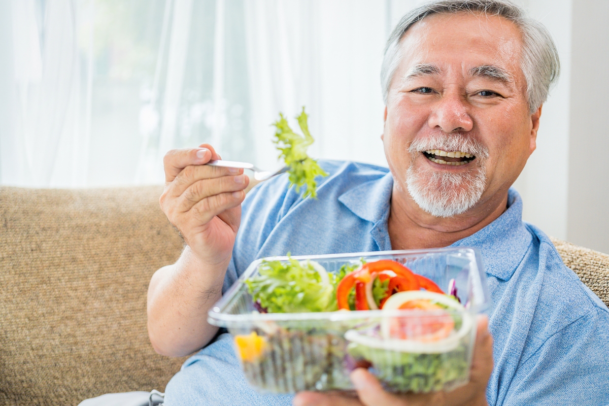 Senior man eating