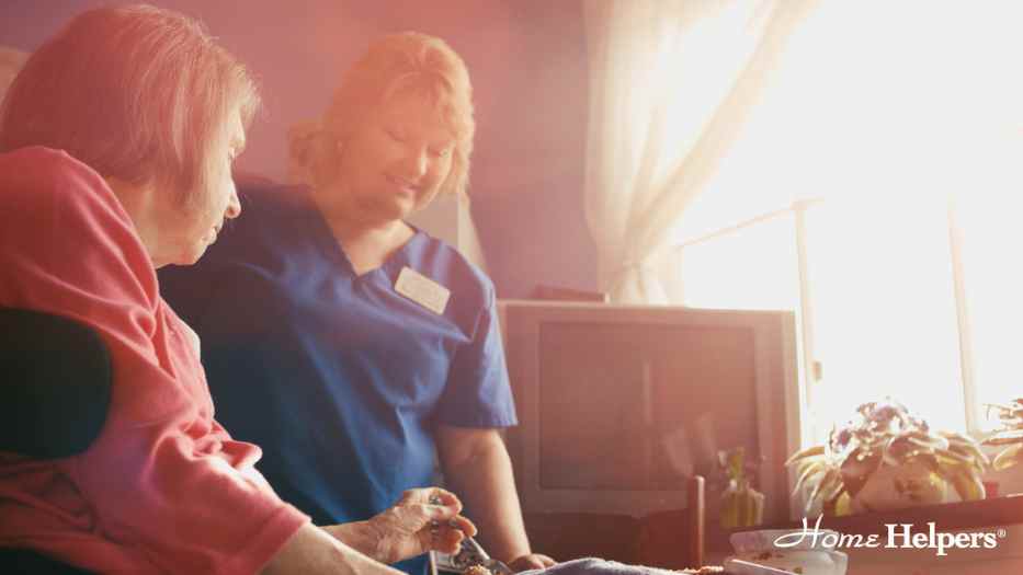 Home health aide helping a senior with meal preparation