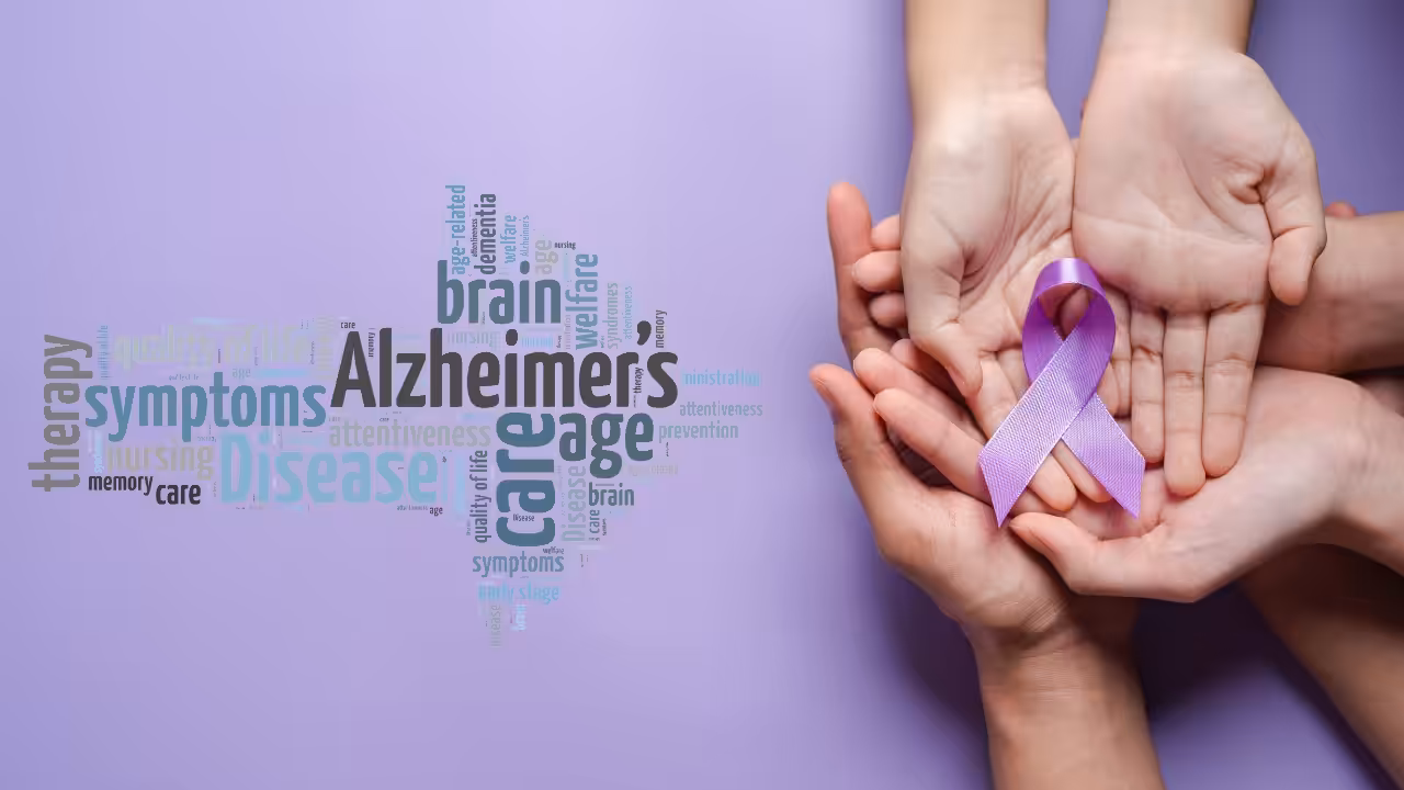 Four hands gently hold a purple awareness ribbon, symbolizing Alzheimers awareness, against a purple background with a related word cloud including words like Alzheimers, brain, care, and symptoms.