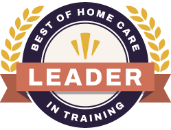 Circular badge with gold laurel leaves, the words Best of Home Care at the top, Leader in Training at the bottom, and a central orange ribbon labeled Leader..