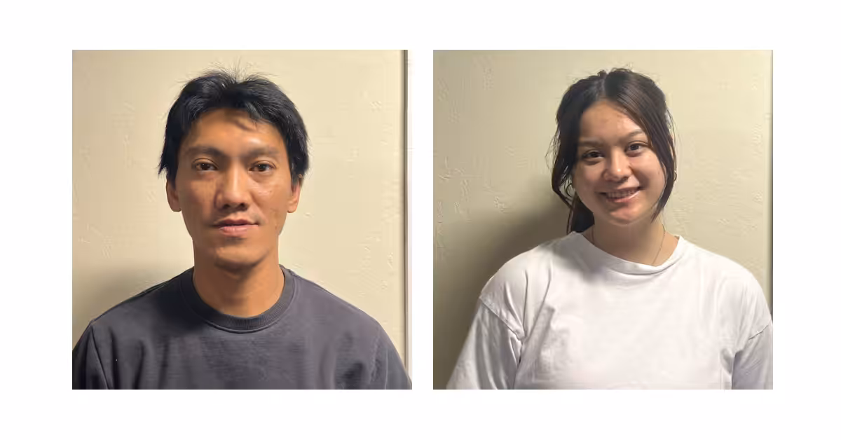 Side-by-side portraits of a man in a dark shirt and a woman in a white shirt, both standing against a light-colored wall and looking at the camera, with the woman smiling.