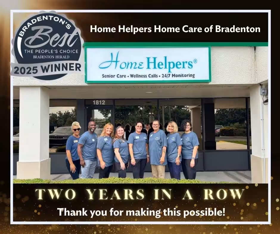 A group of nine Home Helpers staff stand smiling in front of their office. The image announces their “Bradenton’s Best 2025 Winner” award for two years in a row, thanking supporters for making it possible.