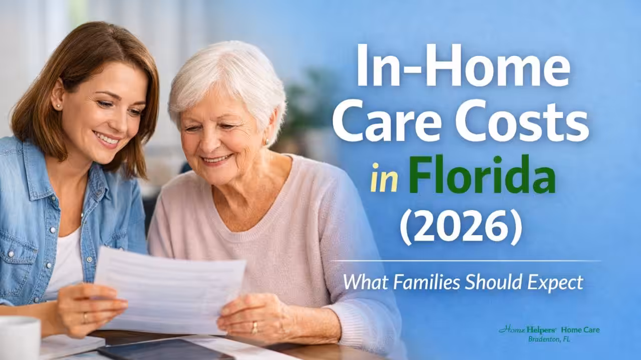 Two women, one younger and one older, sit together smiling and reviewing a document. The text reads: In-Home Care Costs in Florida (2026) What Families Should Expect.