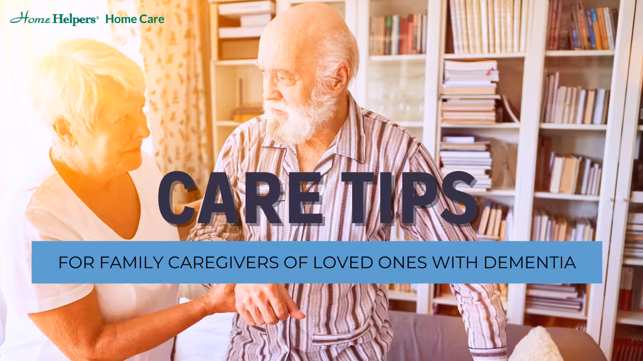 An elderly man with a white beard stands beside a concerned woman in a cozy, book-filled living room. Text reads: Care Tips for Family Caregivers of Loved Ones with Dementia.