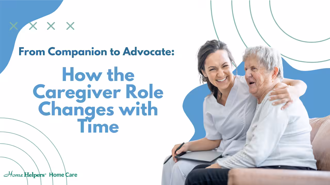 A smiling caregiver sits on a couch with her arm around an elderly woman, both appearing happy. The text reads: From Companion to Advocate: How the Caregiver Role Changes with Time. Home Helpers Home Care logo is visible.