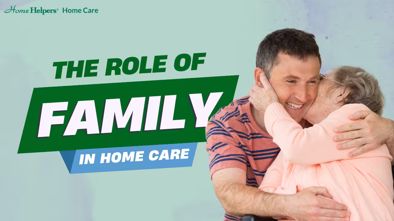 A man smiles and hugs an elderly woman in a wheelchair. Text on the image reads: THE ROLE OF FAMILY IN HOME CARE. Home Helpers Home Care logo is in the top left corner.