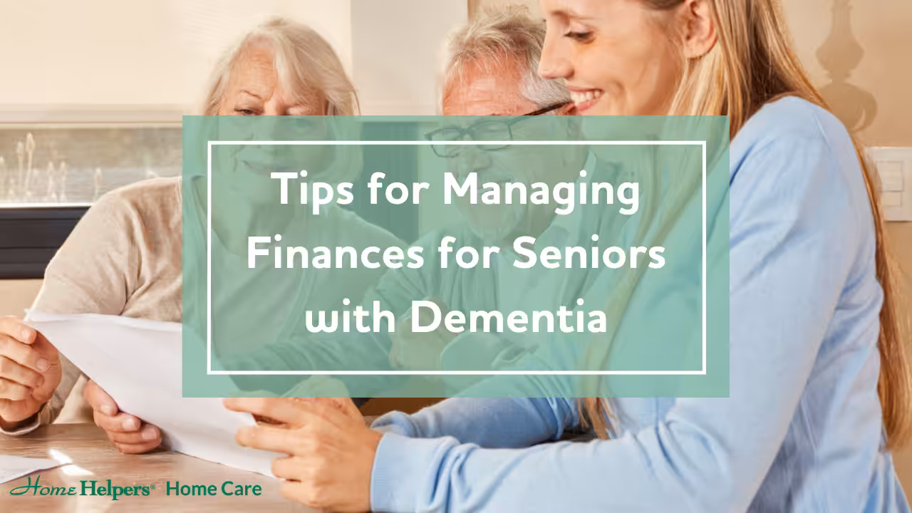 Three people sit at a table reviewing documents, with a green overlay containing the text: Tips for Managing Finances for Seniors with Dementia. The Home Helpers Home Care logo is in the corner.