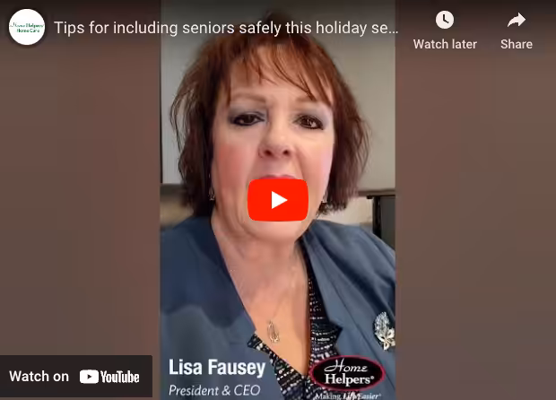 Close-up of a woman speaking in a YouTube video titled Tips for including seniors safely this holiday season. Text on screen reads Lisa Fausey, President & CEO, Home Helpers. YouTube branding appears at the bottom.