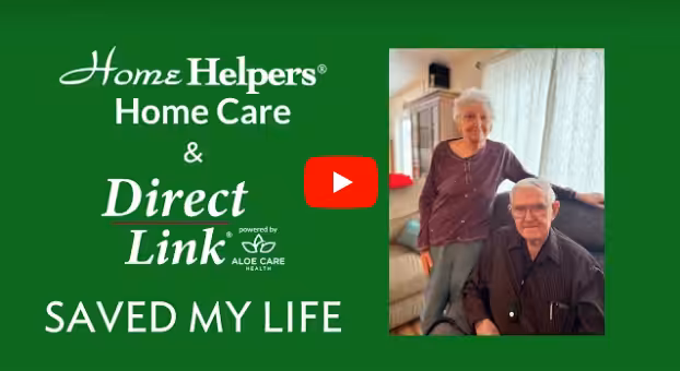 Promotional image for Home Helpers Home Care and Direct Link shows an elderly woman standing beside an elderly man seated in a living room. Text reads, Home Helpers Home Care & Direct Link saved my life.