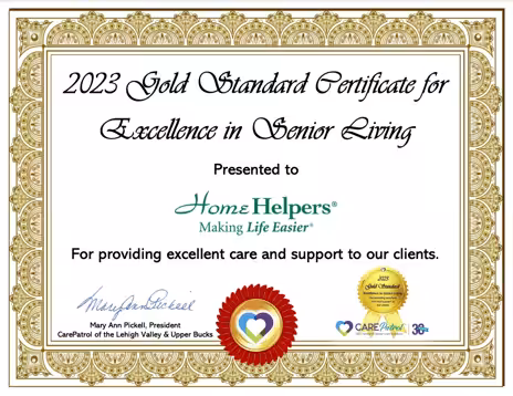 A certificate with a gold decorative border awarded to Home Helpers for excellence in senior living, recognizing their excellent care and support to clients. Signed by Mary Ann Pickell, President of CarePatrol of the Lehigh Valley & Upper Bucks.