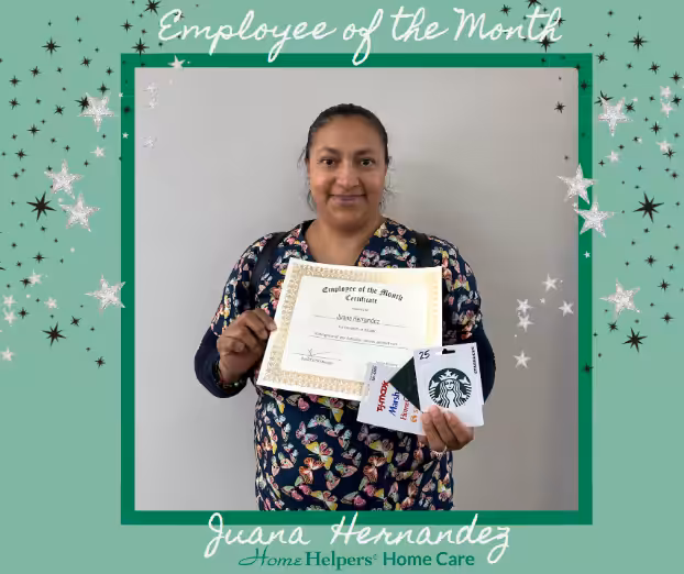 A woman stands holding a certificate and two gift cards, framed by a green border with stars. Text reads Employee of the Month and Juana Hernandez, Home Helpers Home Care.