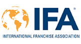 Logo of the International Franchise Association (IFA), featuring a globe with orange continents beside large blue letters IFA and the organizations full name written below in orange and blue.