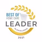 Circular badge with a gold laurel wreath reads Best of Home Care Leader in Excellence 2021. The text is centered, with Leader in bold and a gold arc beneath it.