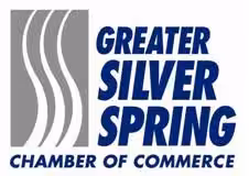 Logo of the Greater Silver Spring Chamber of Commerce, featuring three white wavy lines on a gray square next to bold blue text that reads Greater Silver Spring Chamber of Commerce.