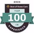 A badge reading 2024 Best of Home Care Top 100 in Experience in black, white, and teal colors, signifying a top ranking for home care experience.