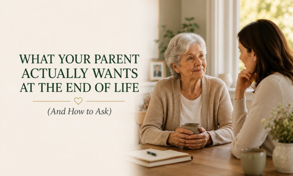 Two women sit at a table with mugs, having a serious conversation. Text reads, What your parent actually wants at the end of life (and how to ask). A notebook and plant are on the table.